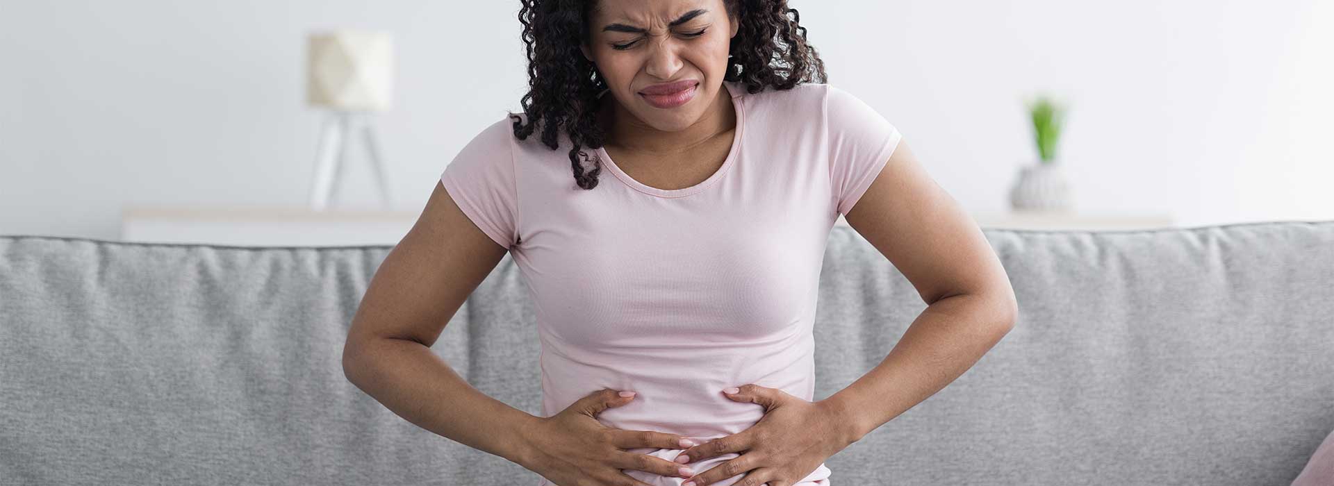 Mature woman suffering from gastritis