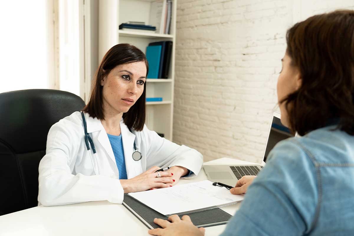 Patient discussing about treatments with her doctor