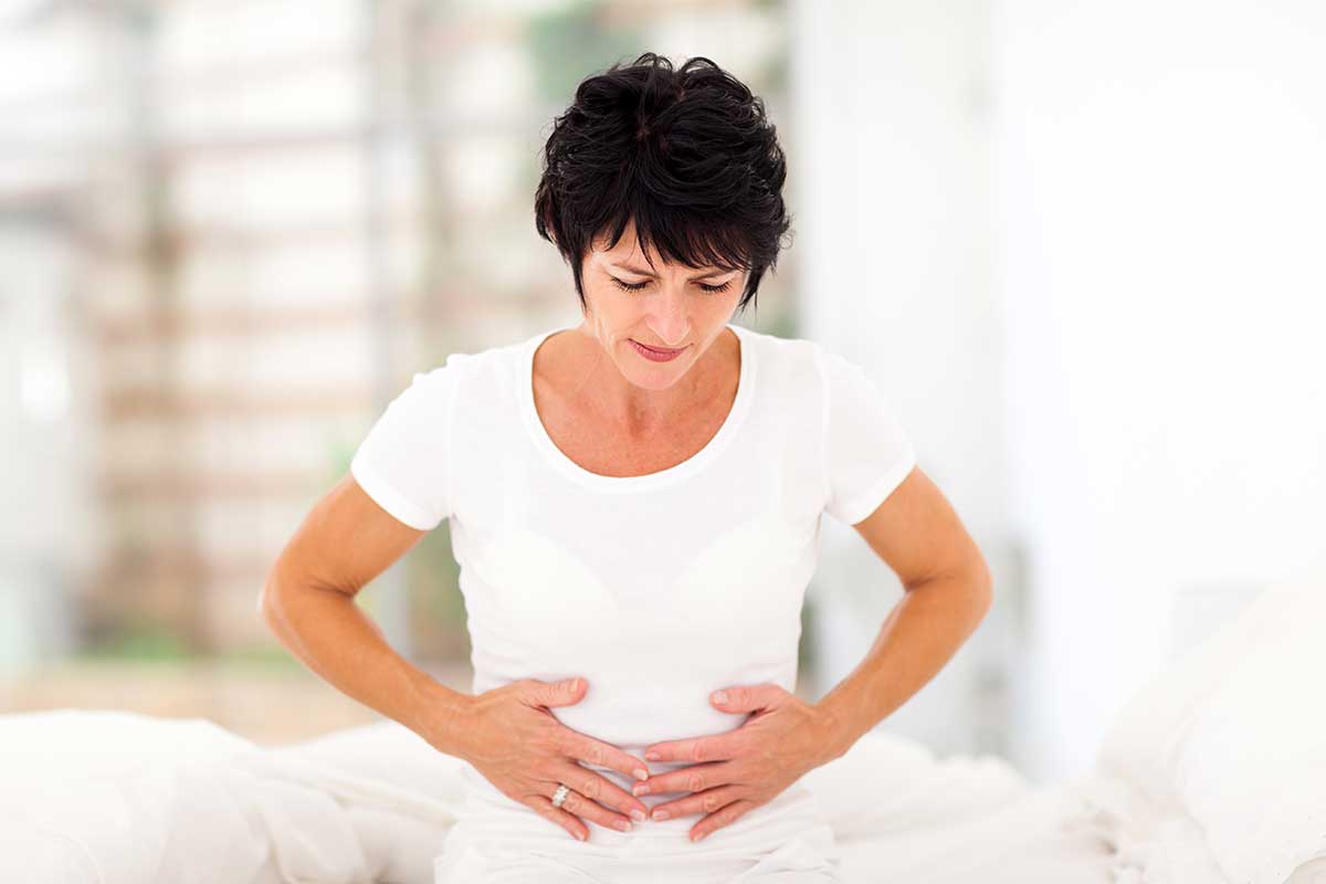 Mature woman sufferings from stomach pain